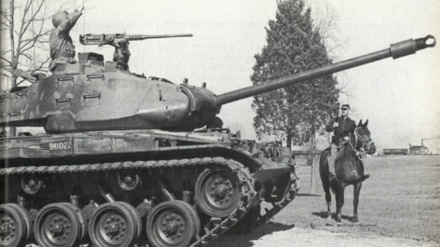 Image taken after World War II of horse and rider and a tank
