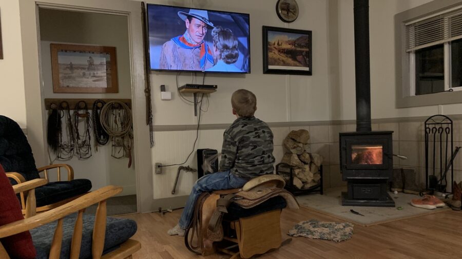 The author’s seven-year-old son likes to ride and rope along with the star of each Western movie.
